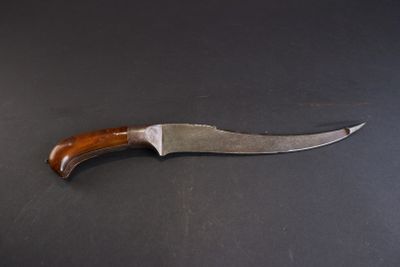 a knife that is laying on a table