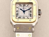 an image of a silver and gold wrist watch with roman numerals