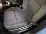 a seat in the back of a car with a steering wheel