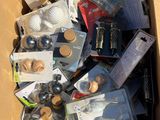a cardboard box full of assorted items in it