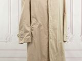 a beige trench coat on a mannequin mannequin mannequin mannequin mannequin mannequin mannequin mannequin manne