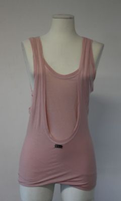 a female mannequin wearing a pink tank top on a white mannequin