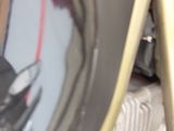 a reflection of a person in the mirror of a motorcycle