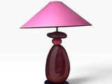 purple glass table lamp with a pink shade on a black base