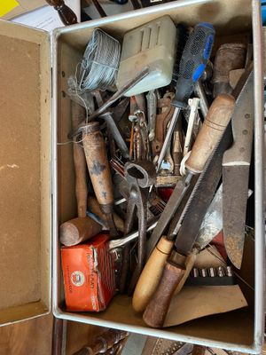 a box full of tools sitting on top of a table