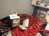 a lot of wires and electrical equipment in a room
