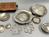a table with a lot of silver items on it