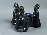 two figurines that are sitting next to each other