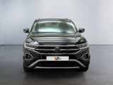 the front of a black volkswagen suv parked in a white room