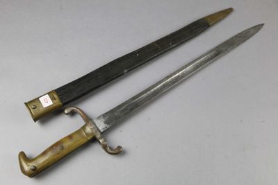pair of two old swords on a white surface