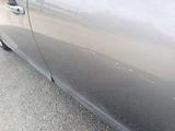a close up of a car ' s door handle and door handle