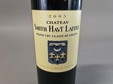 a bottle of wine that is sitting on a table