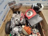 a wooden box filled with assorted motor parts