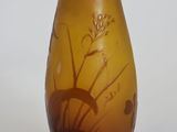 a glass vase with a design on it sitting on a table
