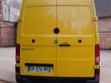 a yellow van that is parked on the side of the road
