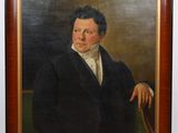 portrait of a man in a black suit and white shirt