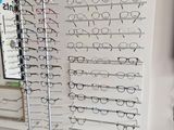 a display of glasses on a wall in a store