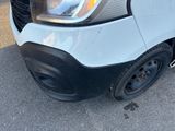 a close up of a white truck with black rims