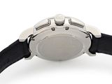 a close up of a watch on a white surface