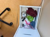 a small white box that has a bunch of items inside of it