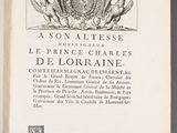 an old book with a picture of a coat of arms on it