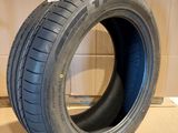 a close up of a tire on a cardboard box in a room