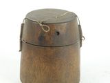 a small wooden box with a rope around it