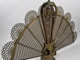 a metal fan that is sitting on top of a table