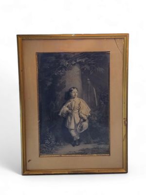 an old picture of a young boy in a white coat is shown in a gold frame