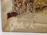 a picture of a gold plate with a bird on it