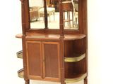 a wooden cabinet with a mirror on top of it