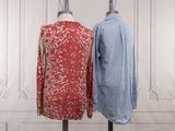 two women ' s shirts on a mannequin stand in front of a white wall