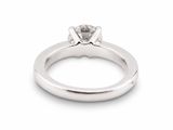 a close up of a diamond ring on a white background