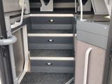 a view of the inside of a bus with stairs