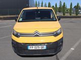 a yellow van that is parked in a parking lot