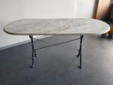 a table with a marble top in a room