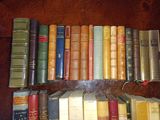 a lot of books that are sitting on a table