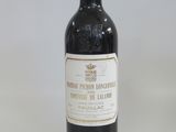 a bottle of wine that is sitting on a table