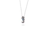 a close up of a necklace with a seahorse on a chain