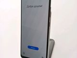 the back of a phone with a message on it sitting on top of a stand