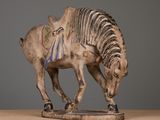 a statue of a zebra with a saddle on it ' s back