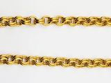 a close up of a gold chain bracelet on a white background