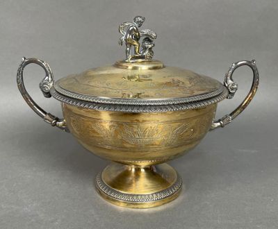 an antique silver plated bowl with a lid and handles