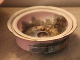 a dirty bowl sitting on a counter next to a bowl of food