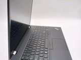 a laptop computer that is open on a white surface