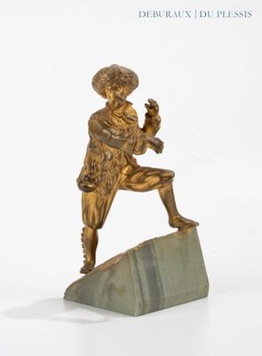 bronze statue of a man holding a bird on a marble block
