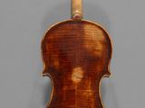 an old violin with a wooden back and a long neck