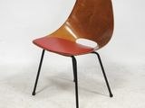 an image of a chair with a red seat and black legs