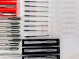 many different types of screws in a plastic box