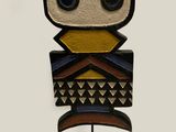 a close up of a wooden sculpture of an owl on a stand